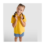 Polo avec logo en tricot piqué 100% coton pour enfants 200 g/m² Roly couleur jaune image nature morte