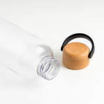 Bouteille en tritan avec bouchon en bambou et anse de transport 1L