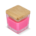Bougie en cire végétale dans un pot en verre avec couvercle en bambou couleur rose