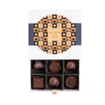 Coffret de 9 bonbons chocolat au lait fourrés au café ou prunes couleur blanc