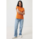 Polo femme coupe décontractée en coton piqué recyclé 220 g/m² Iqoniq couleur orange vue avec modèle