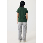 Polo femme coupe décontractée en coton piqué recyclé 220 g/m² Iqoniq couleur vert forêt quatrième vue avec modèle