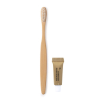 Brosse à dents en bambou et dentifrice dans une boîte en carton couleur naturel première vue