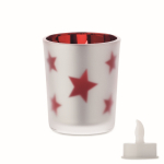 Bougie LED dans un pot en verre avec des petites étoiles de Noël couleur rouge