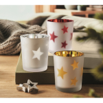 Bougie LED dans un pot en verre avec des petites étoiles de Noël couleur rouge vue d'ambiance