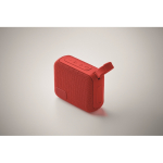 Petit haut-parleur sans fil avec poignée assortie pour le transport couleur rouge quatrième vue photographique