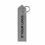 Porte-clés personnalisable en forme d’étiquette avec côté en pointe couleur gris vue avec zone d'impression
