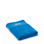 Serviette de bain 100 % coton éponge 380 g/m² 70x140 cm couleur bleu vue avec zone d'impression