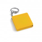 Porte-clé avec un mètre ruban de 1m couleur jaune