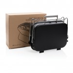 Barbecue portable avec format valise couleur noir vue dans une boîte