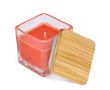 Bougie en cire végétale dans un pot en verre avec couvercle en bambou couleur orange