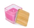 Bougie en cire végétale dans un pot en verre avec couvercle en bambou couleur rose