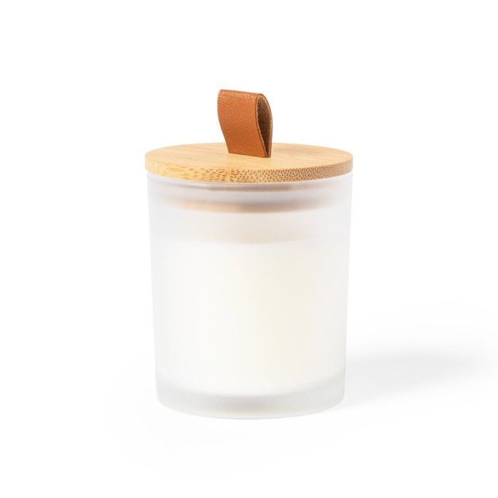 Bougie dans un pot en verre coloré
