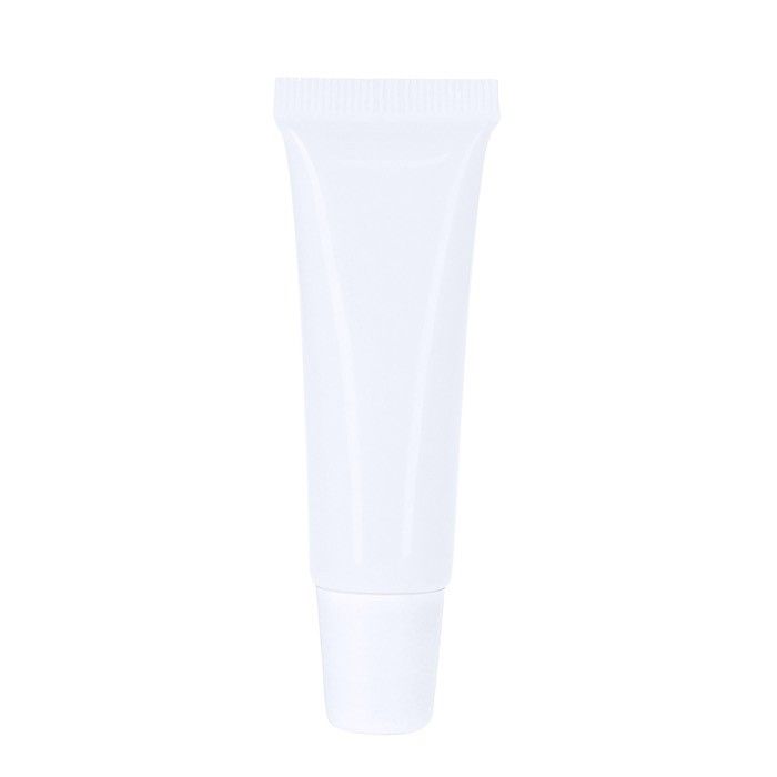 Baume à lèvres crème dans tube blanc avec capuchon coloré, SPF 15