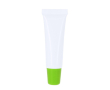 Baume à lèvres crème dans tube blanc avec capuchon coloré, SPF 15 couleur vert