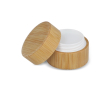 Baume à lèvres dans un étui en bambou de forme cylindrique couleur naturel