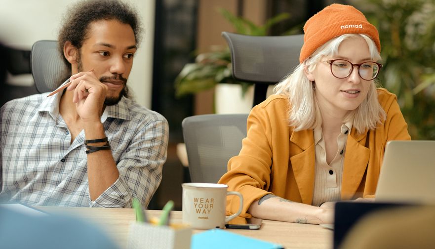 Woman at the office with branded mug and pen