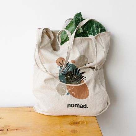 Woman with a printed tote bag to promote a brand